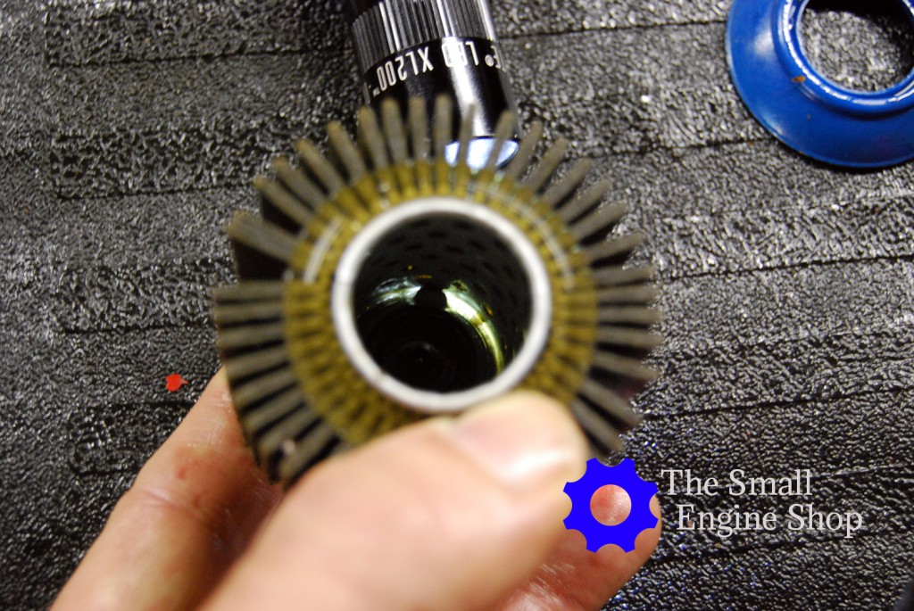 Here you can see the light shining through the clear epoxy making appear that there is a space between the bypass valve and paper filter element.