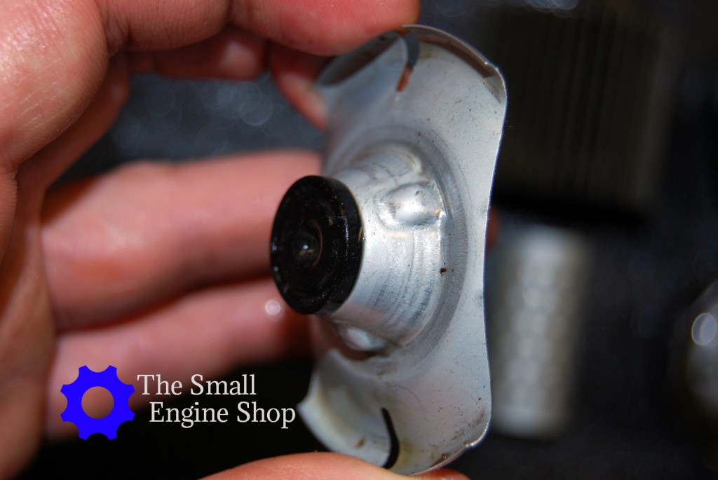 Bypass valve opposite the side with the spring.. This side fits into the paper filter.